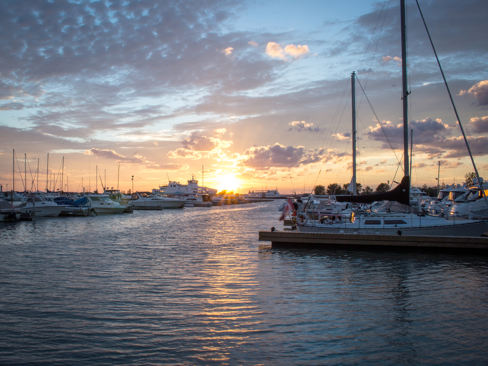 A beautiful sunset over Leamington Marina with boats in the foreground.